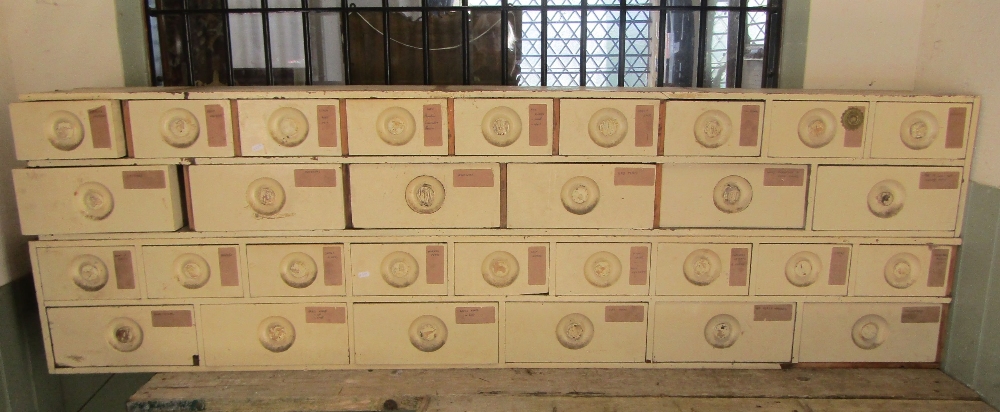 A two sectional bank/nest of 19th century mahogany faced and pine framed apothecary drawers with