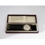 Mid-20th century Garrard 9ct gentleman's wrist watch with champagne dial, Arabic numerals and