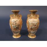 A pair of early 20th century Satsuma vases of shouldered form with pierced handles and painted and