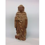 Early carved wooden monk with traces of original paint, 34cm high