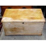 A 19th century stripped pine box with hinged lid and exposed dovetail construction