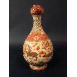 An oriental vase, the upper section of onion shaped form with polychrome painted decoration of