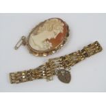 A 9ct gate link bracelet with heart padlock clasp, together with a 9ct cameo brooch depicting a lady