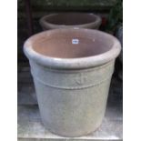 A pair of weathered contemporary clay planters of cylindrical form with raised anchor and rope twist