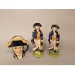 A Royal Doulton character jug - Lord Nelson, together with two Staffordshire type toby jugs in the