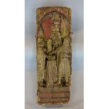 Antique carved pine panel, decorated in high relief with knights outside a castle, with faint