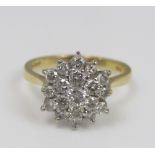 An 18ct three tier diamond cluster ring, size O, 4.6g