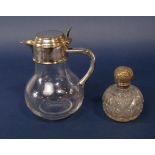 Attractive white metal and glass claret jug, with silver plated lid and thumb piece over a white