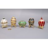 Five decorative enamelled eggs upon stand in the Russian manner, all boxed