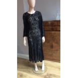 Two full length 1930s evening dresses, both sleeveless, one with sheer black lace and sequinned V