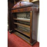 A Georgian mahogany open bookcase with arched pediment and inlaid banded detail, three adjustable