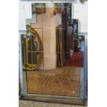 An Art Deco style wall mirror, the stepped frame enclosing segmented peach tinted and clear mirror