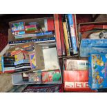 A vast collection of vintage childrens toys and games spread amongst four large boxes