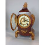 1882 American Ansonia clock, in a mottled metal case with Rococo stylings, with enamelled chapter