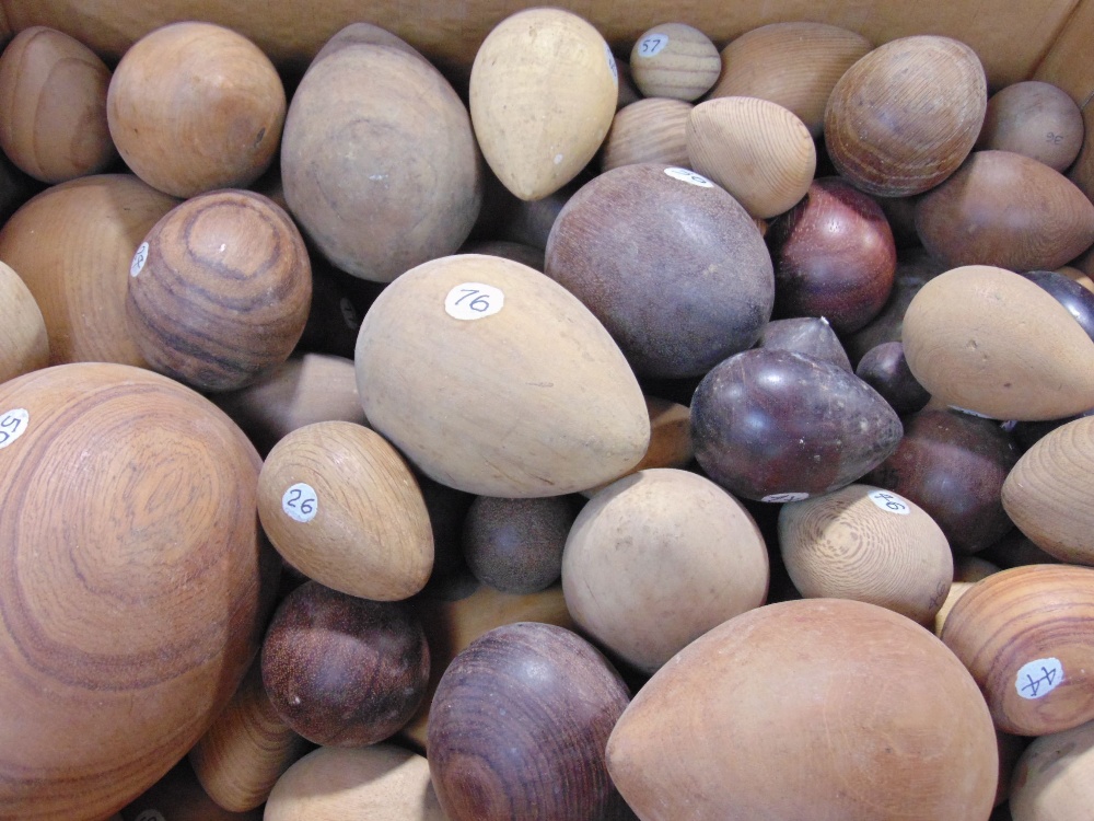 A collection of carved treen eggs