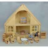 Contemporary beechwood Scandinavian doll's house together with a box containing furniture, doll's