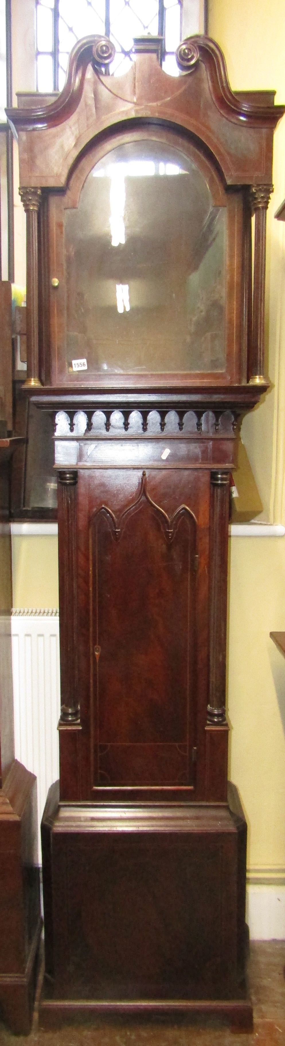 A Regency mahogany longcase clock case with string banded detail, the trunk with reeded column