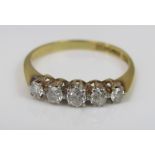 An 18ct five stone diamond ring, size M/N, 2g