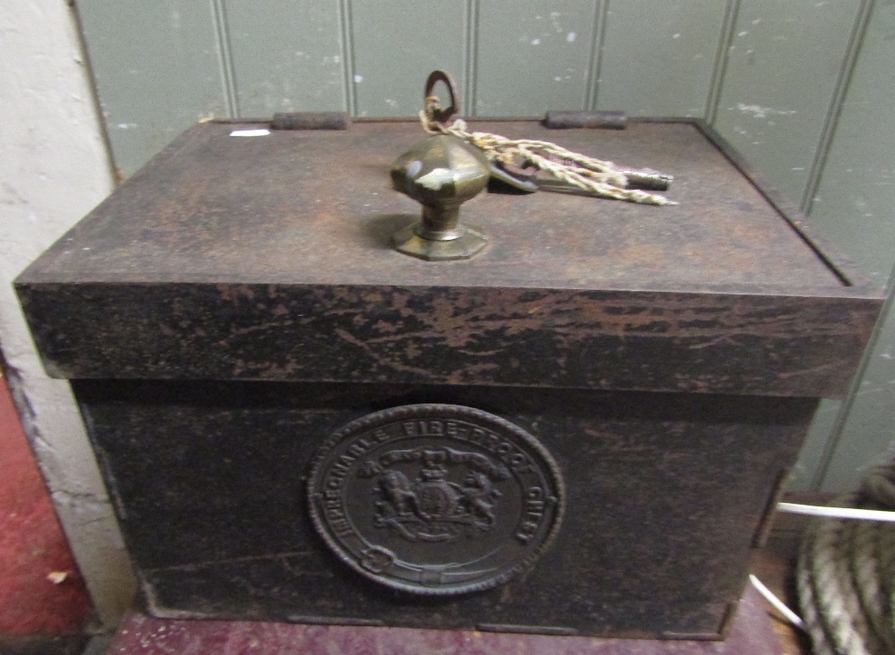 A small impregnable fire proof chest enclosed by a single door with faceted knob handle (complete