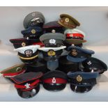 Three boxes of various hats and caps to include many military examples and top hats, etc