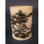 A 19th century oriental brush pot of cylindrical form with monochrome painted landscape and figure