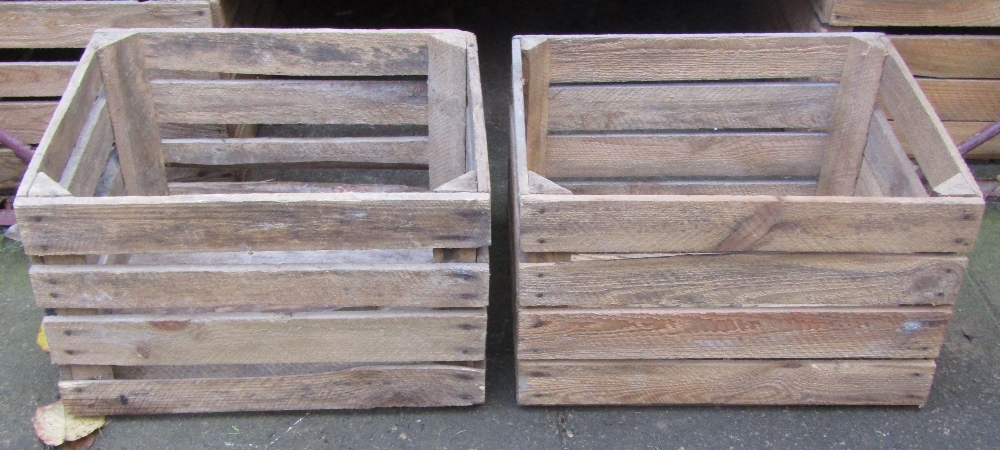 Twelve rustic crates of rectangular open slatted form, 50 cm long x 40 cm wide x 32 cm deep