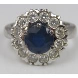 A sapphire and diamond cluster ring in 18ct white gold, size L/M, 6.6g