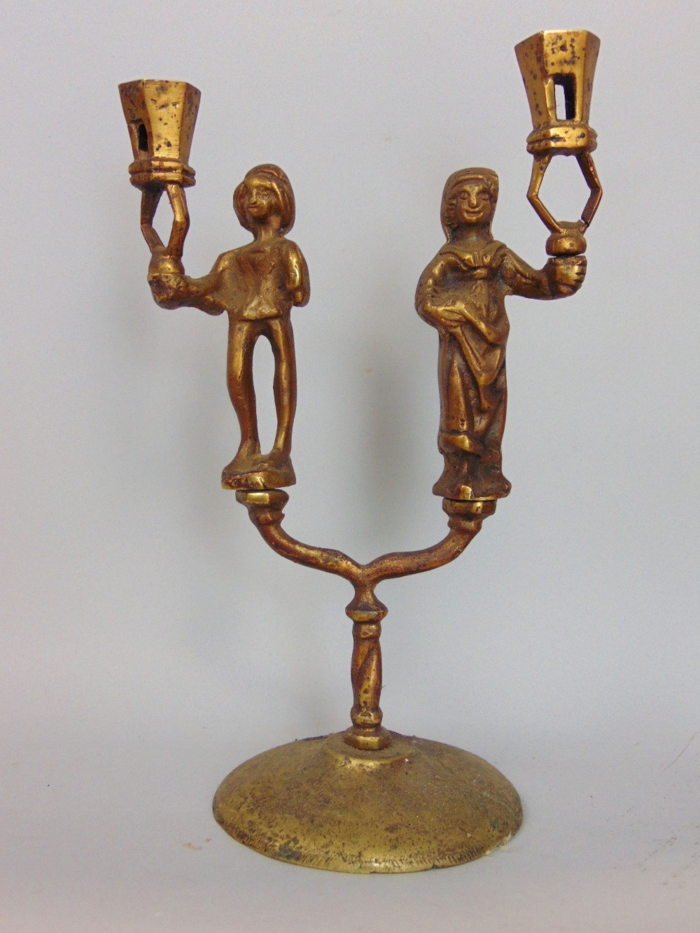 Antique continental cast brass twin branch figural candlestick, 23cm high, together with two gilt - Image 4 of 5