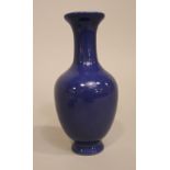 An oriental vase of baluster shaped form with all over dark blue glazed finish and six character