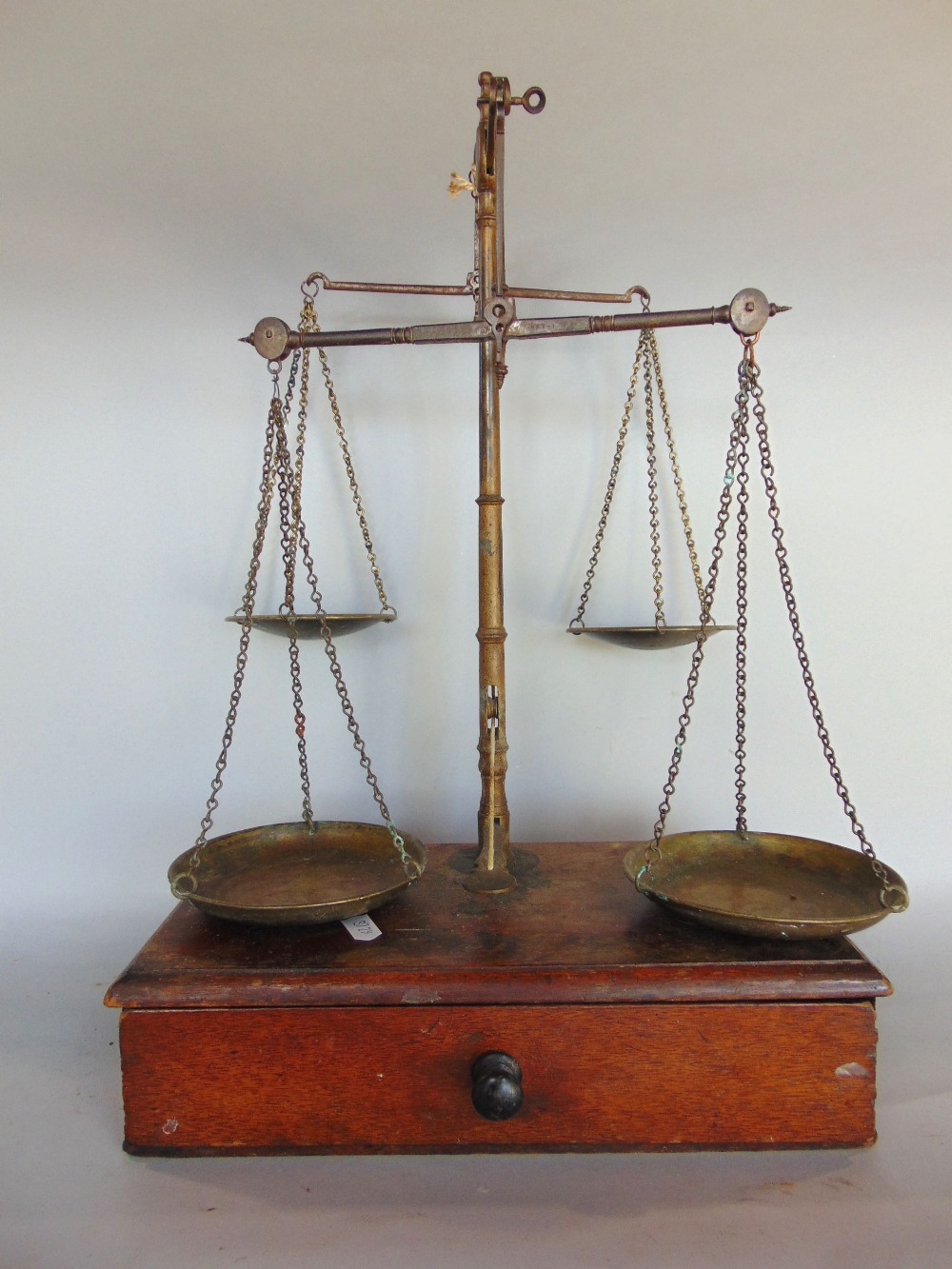 An unusual set of 19th century brass and mahogany twin balance scales, with four pans and weights