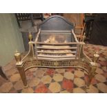A good quality Georgian design fire basket, the serpentine shaped front with pierced brass fluted