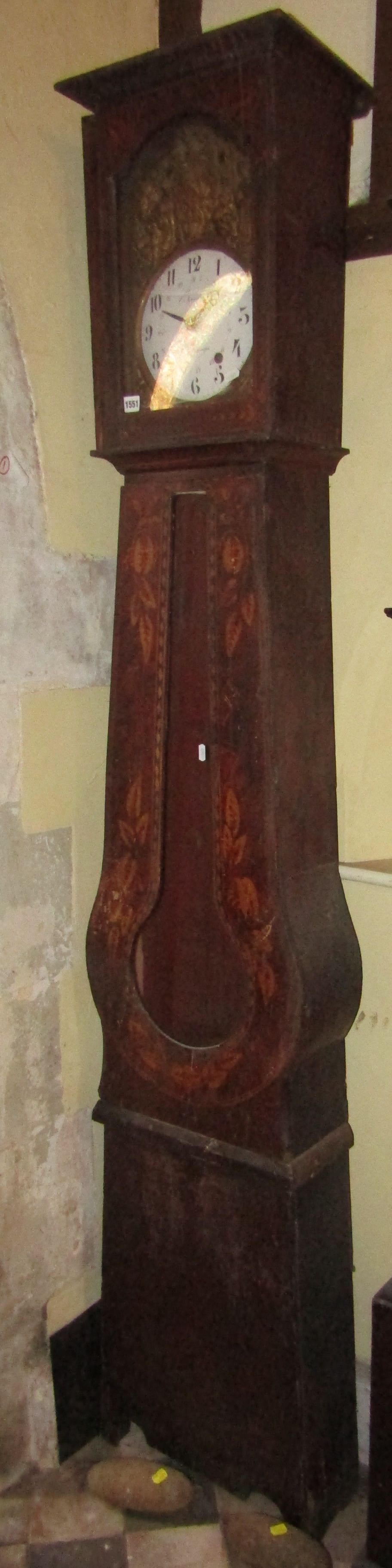 A 19th century long case clock, the pine case of tapering form with original stencilled simulated