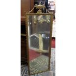 A Georgian style wall mirror of rectangular form with moulded frame, raised urn and trailing