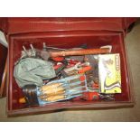 A small Victorian tin trunk containing a quantity of miscellaneous hand tools, to include a