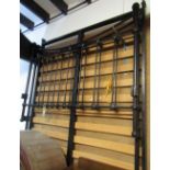 A Victorian style cast japanned metal 4ft 6 double bedstead with vertical rails and knob finials