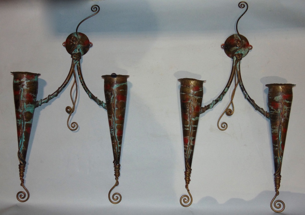 Pair of bespoke brass conical twin branch wall lights, with patinated decoration, 60cm high (2)