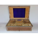 A 19th century Vizagapatam sandalwood and ivory work box/casket, the hinged lid enclosing an