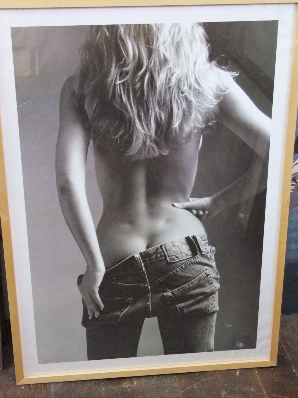 A black and white photographic print of a woman in a pair of Levi jeans, 99 x 69cm in simple