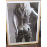 A black and white photographic print of a woman in a pair of Levi jeans, 99 x 69cm in simple