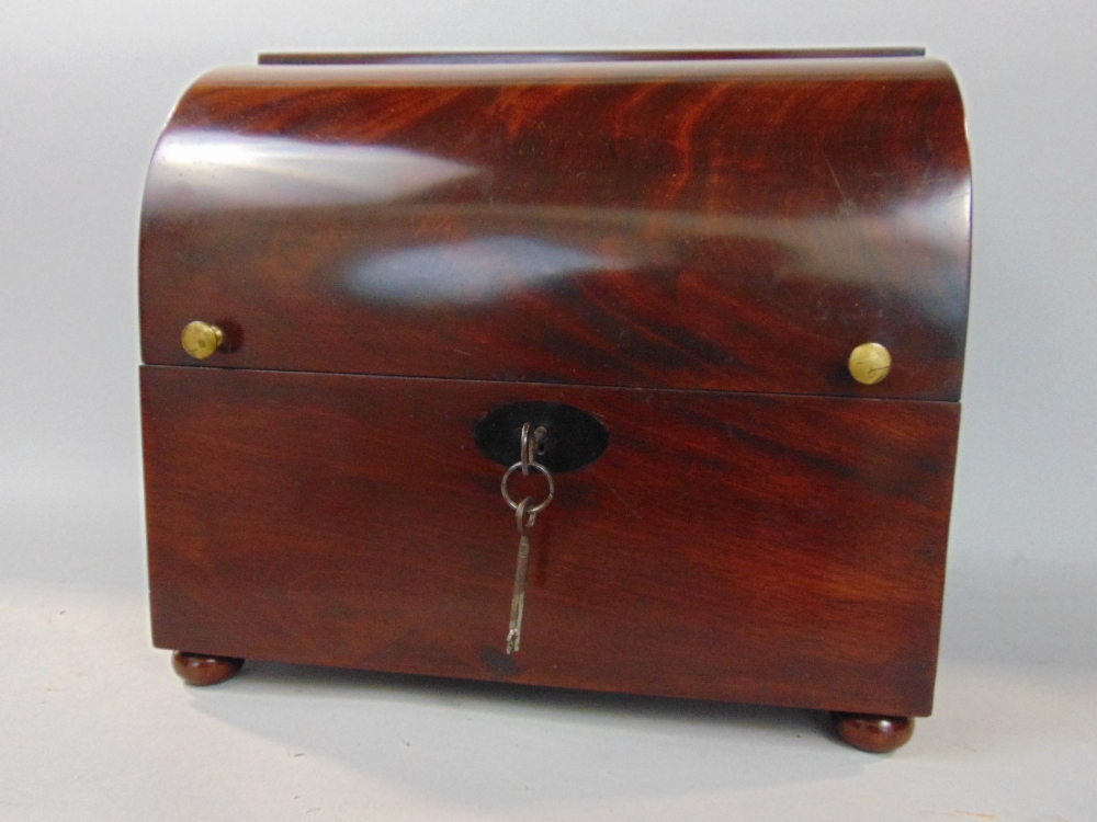 19th century flame mahogany arch fronted decanter box, the hinged lid enclosing a baize lined