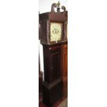 A Georgian oak cottage long case clock with turned column supports, beneath a swan neck frieze,