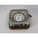 Vintage chrome pocket barometer within an Edwardian silver applied case, the case embossed with