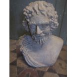 A buff coloured cast composition head and shoulder bust of Bacchus, 50 cm high