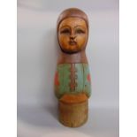 Possibly Scandinavian folk art wooden carving of a girl, with polychrome highlights, 40cm high