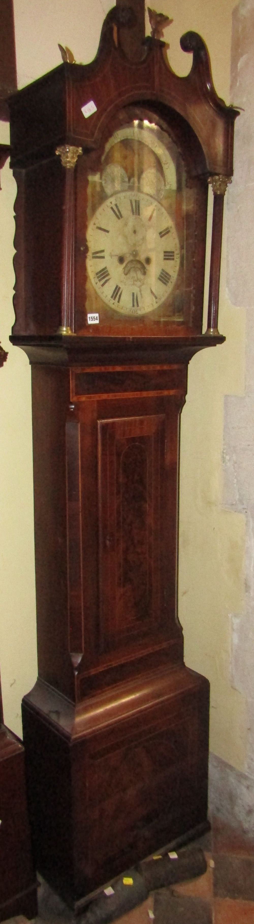 A Georgian longcase clock, cross banded within rosewood and further string inlaid detail, the hood