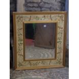 A contemporary wall mirror with moulded gilt frame and wide painted floral marginal surround, 84