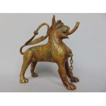 Persian gilt bronze aquafar in the form of a lion with a spout in its teeth and tail handle, 13cm