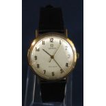 1960s gentleman's 9ct Omega Geneve gentleman's wrist watch, champagne dial with Arabic numerals,