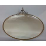 Earl;y 20th century oval bevel glass wall mirror, mounted with an urn and scrolled acanthus with