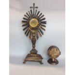 Interesting Catholic white metal and gilt monstrance, with circular bevelled glass plate, mounted